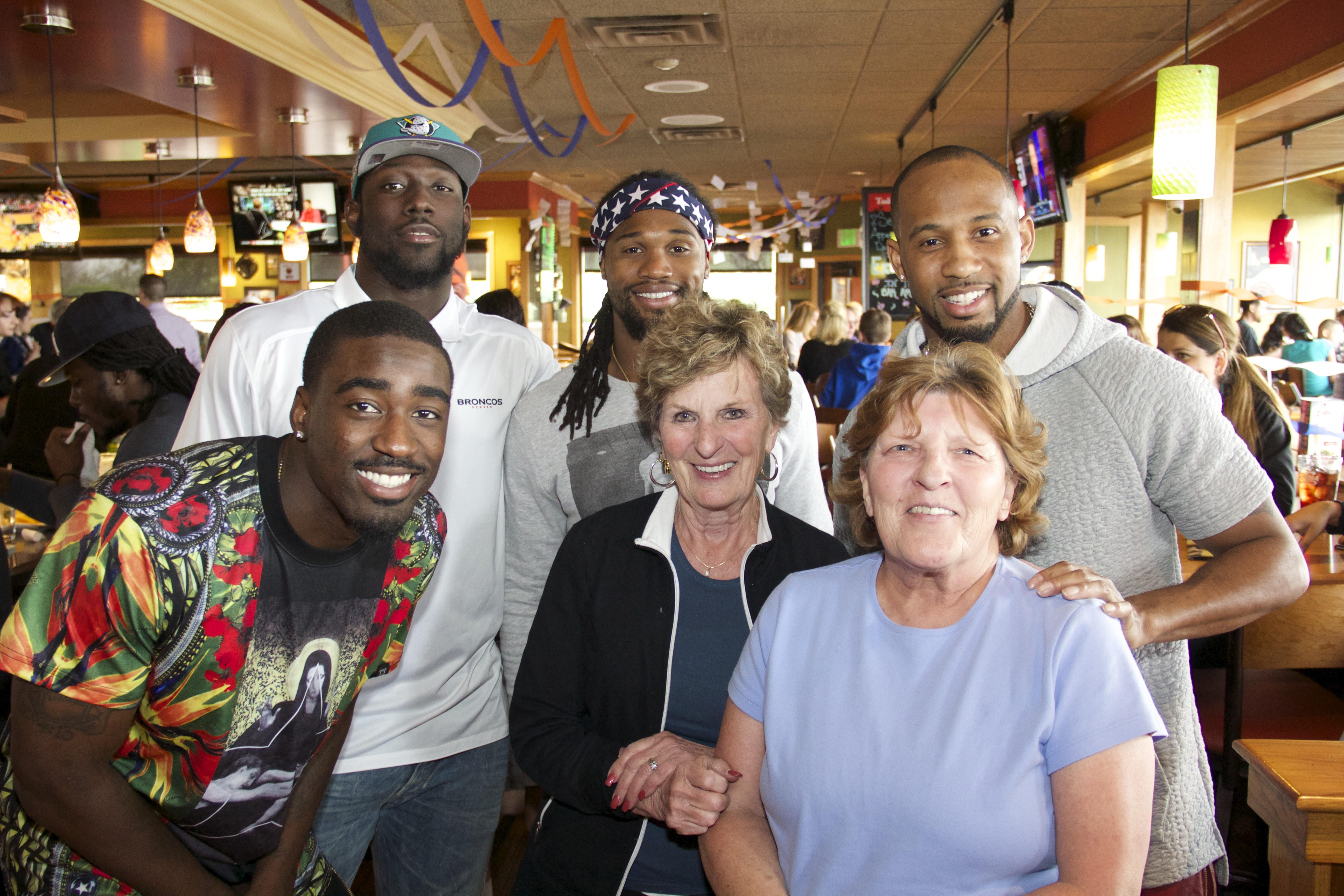 Denver Bronco Players Give Back & Bring In The Donations For Denver’s Tennyson Center